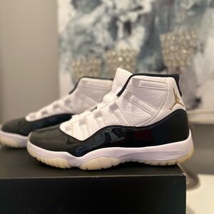 Air Jordan 11 Retro White, Black, and Gold Sneakers